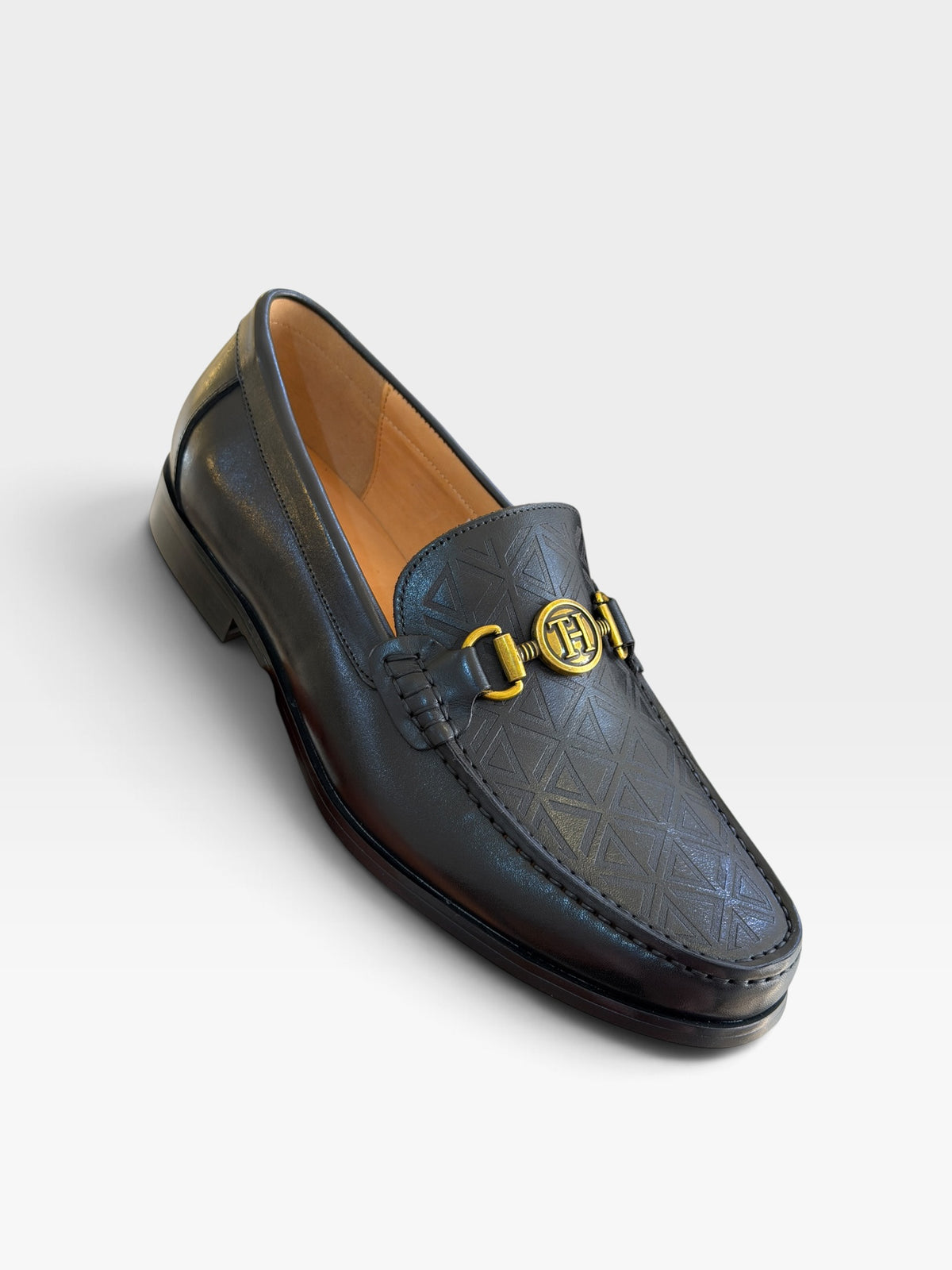 Tishil Aurel Noir black men's loafer with geometric embossed vamp and gold-tone hardware